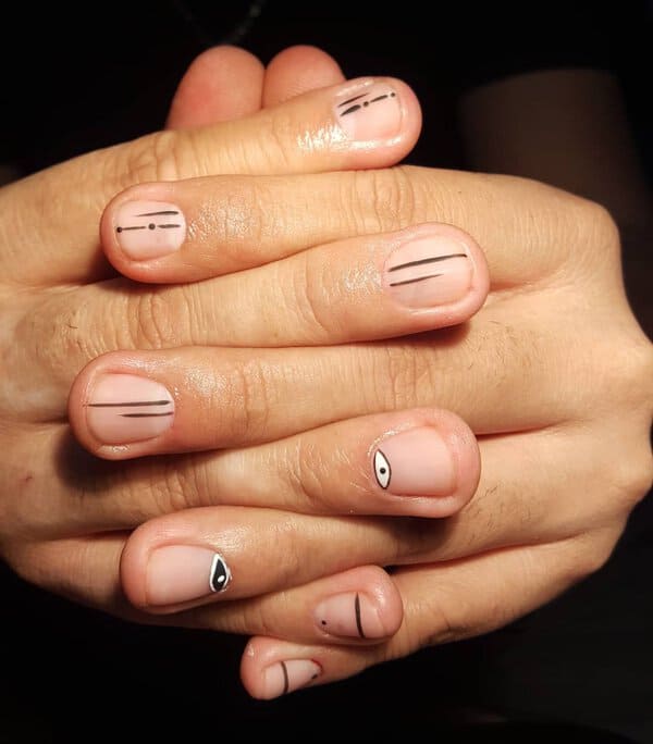 Minimalistic black lines on nude nails