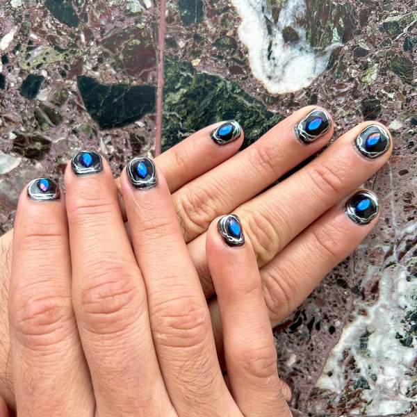 Blue gemstone nail art design