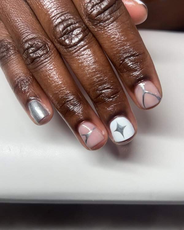 Silver and white star nail art