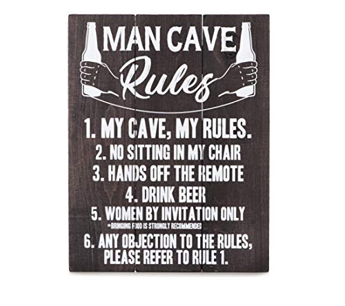 Wooden sign displaying "Man Cave Rules" with humorous text and bottle illustrations.