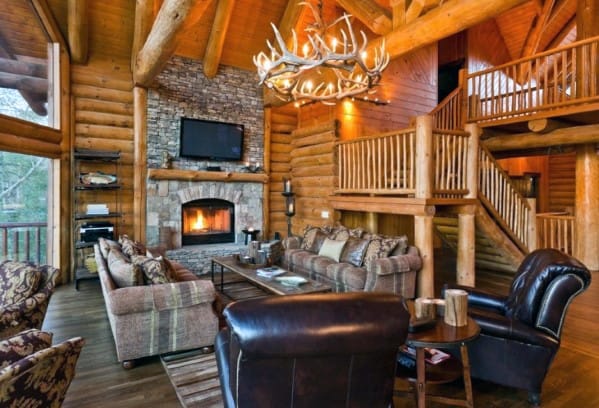 wood cabin living room stone fireplace 