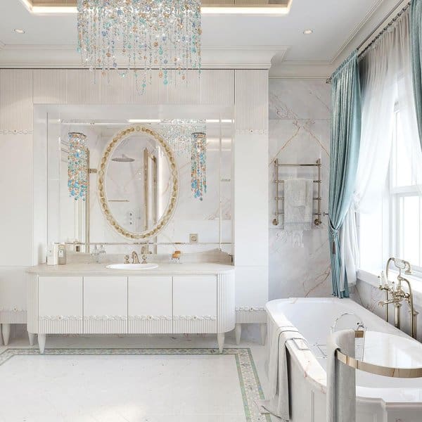 Elegant bathroom with crystal chandelier, oval mirror, and blue draped curtains.