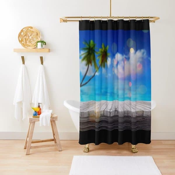 Tropical-themed shower curtain featuring a beach scene with palm trees and ocean in a bright bathroom.