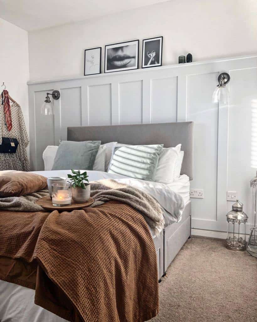 bedroom white wall paneling carpet brown throw rug