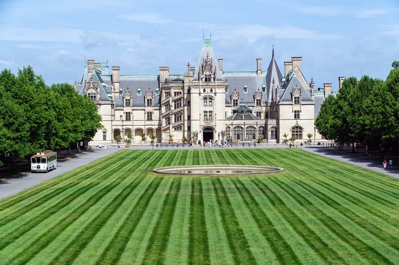 Biltmore Estate in the United States with a grand mansion and manicured striped lawn.