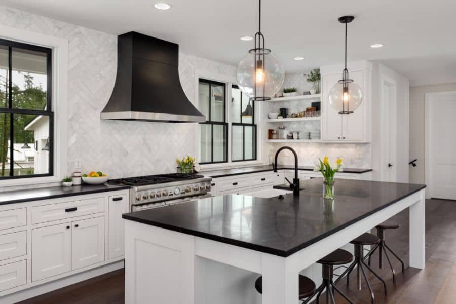 black and white modern kitchen with large island 