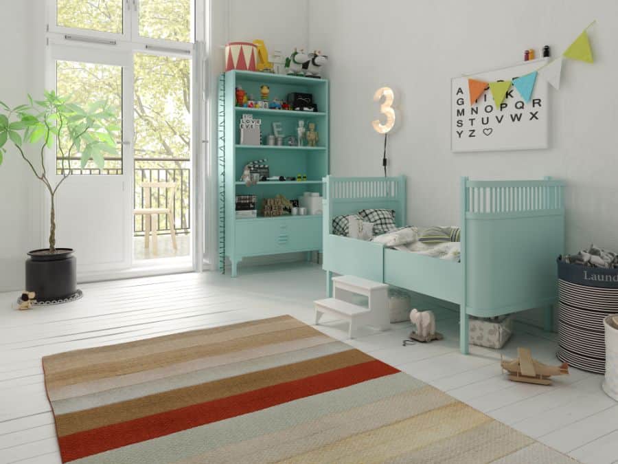 Bright baby boy's room with turquoise bed, storage shelves, and colorful decor accents.