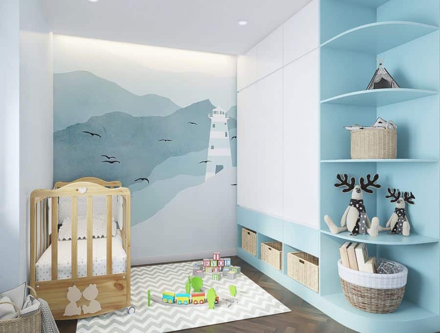 Light blue baby boy's room with a lighthouse mural, wooden crib, and playful decor elements.