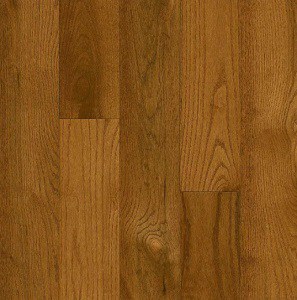 Brown oak hardwood flooring with a smooth finish and natural wood grain pattern.