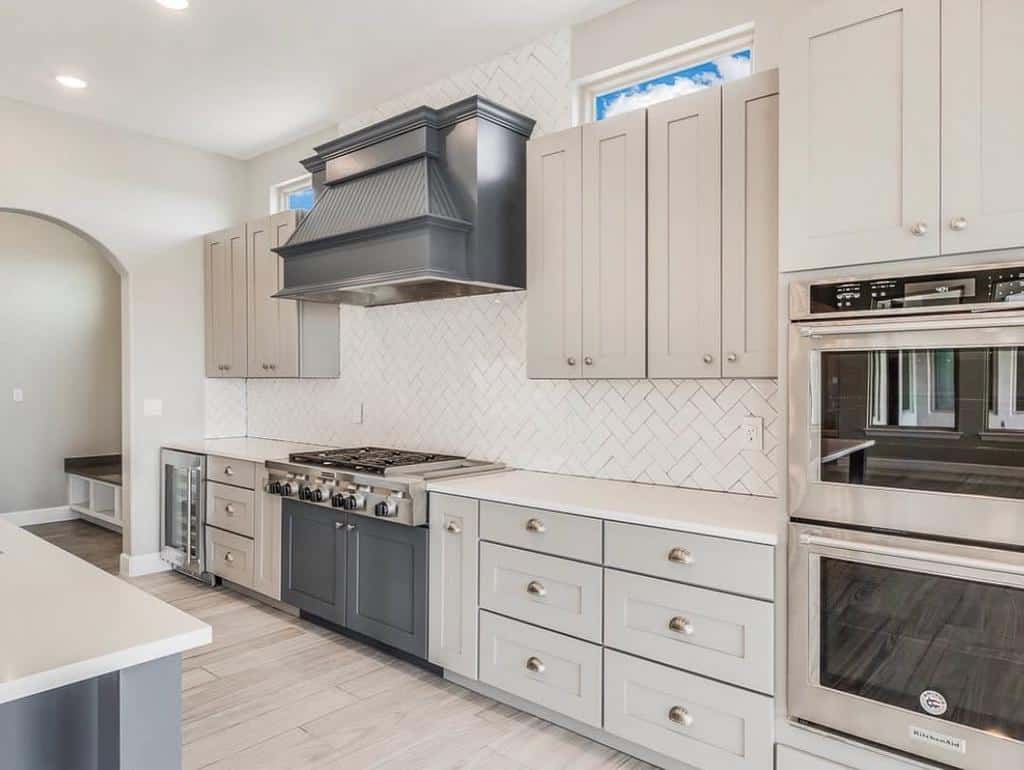 modern white cabinet kitchen white subway tile backsplash 