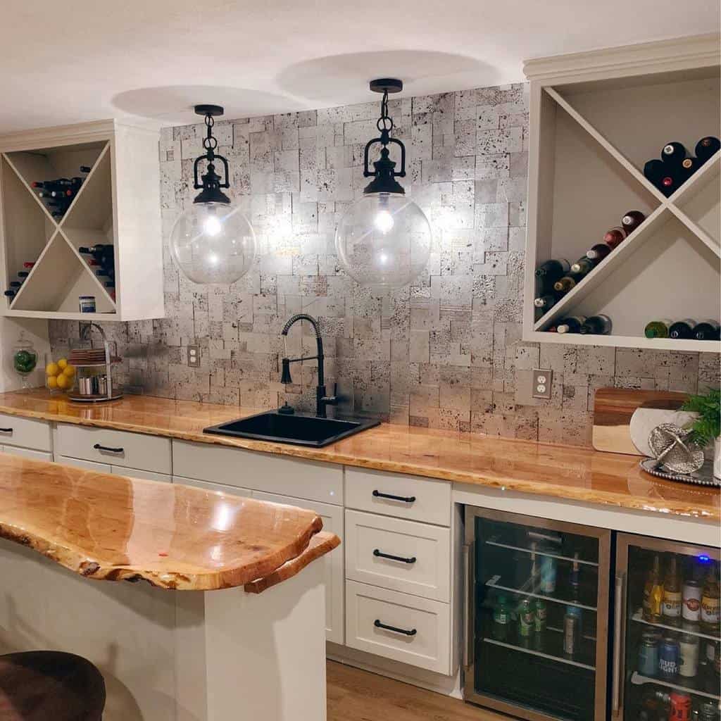 Modern wet bar with live edge wood countertop, mirrored backsplash, and wine storage.