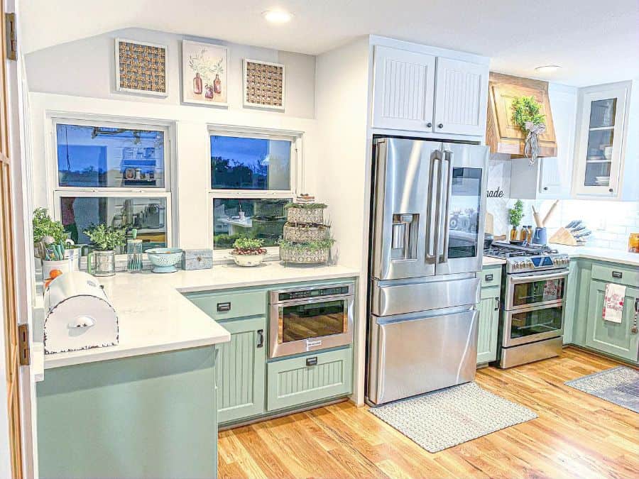 green cabinet farmhouse kitchen with large silver fridge 