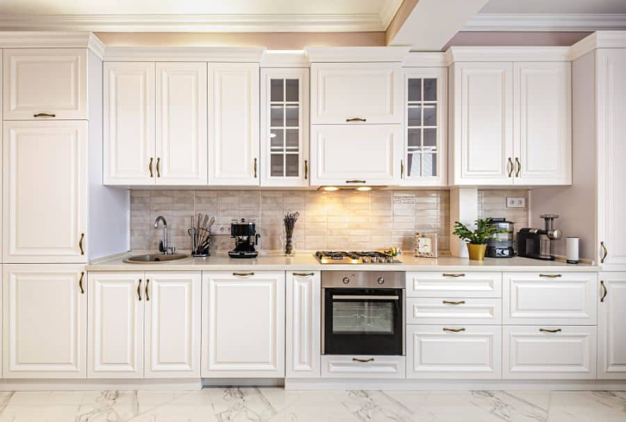 white cabinet kitchen with gold accents 