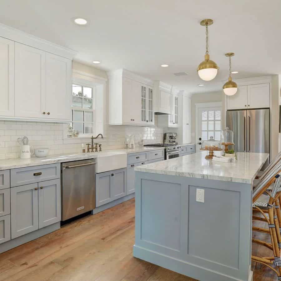 gray and white cabinet kitchen with apron sink 