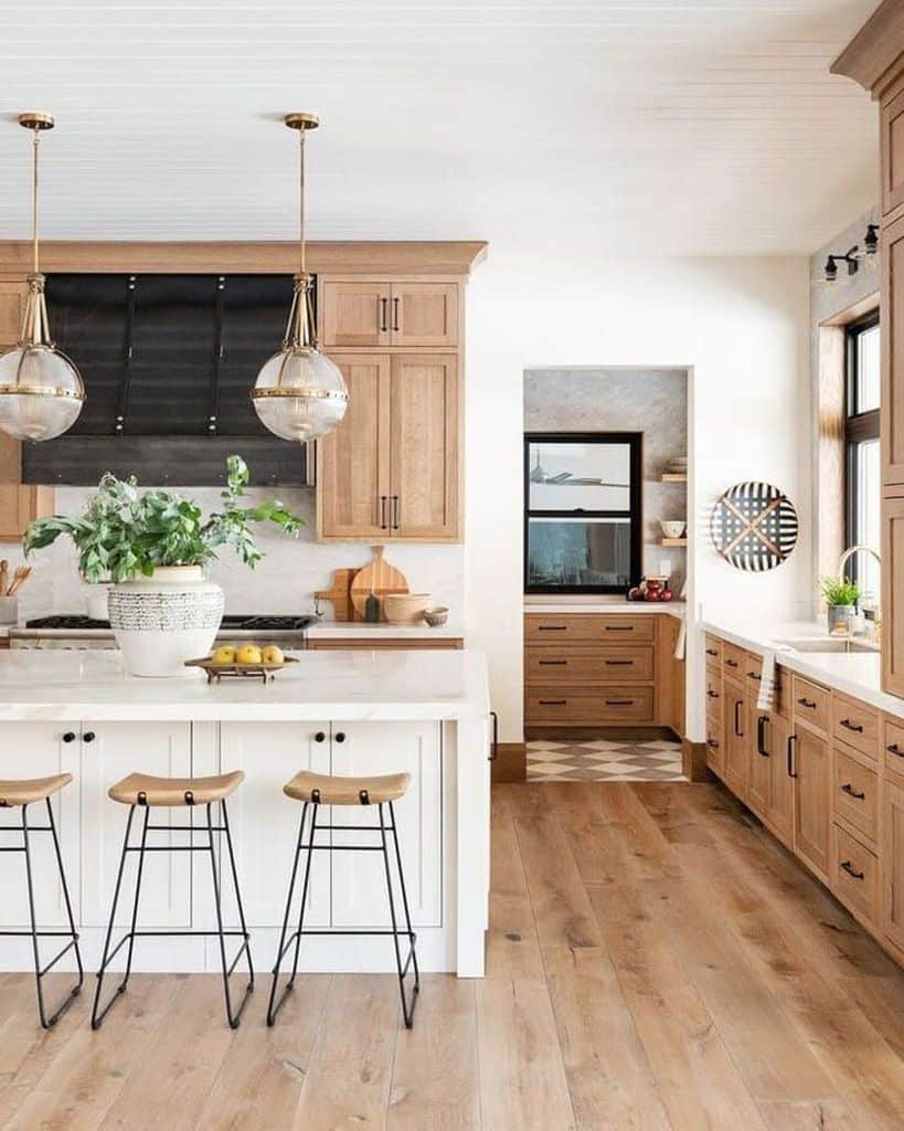 natural wood cabinet farmhouse kitchen with hardwood floors and white island 