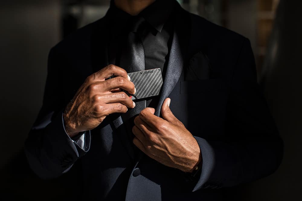 Ridge Carbon Fiber Wallet pulled out of suit jacket