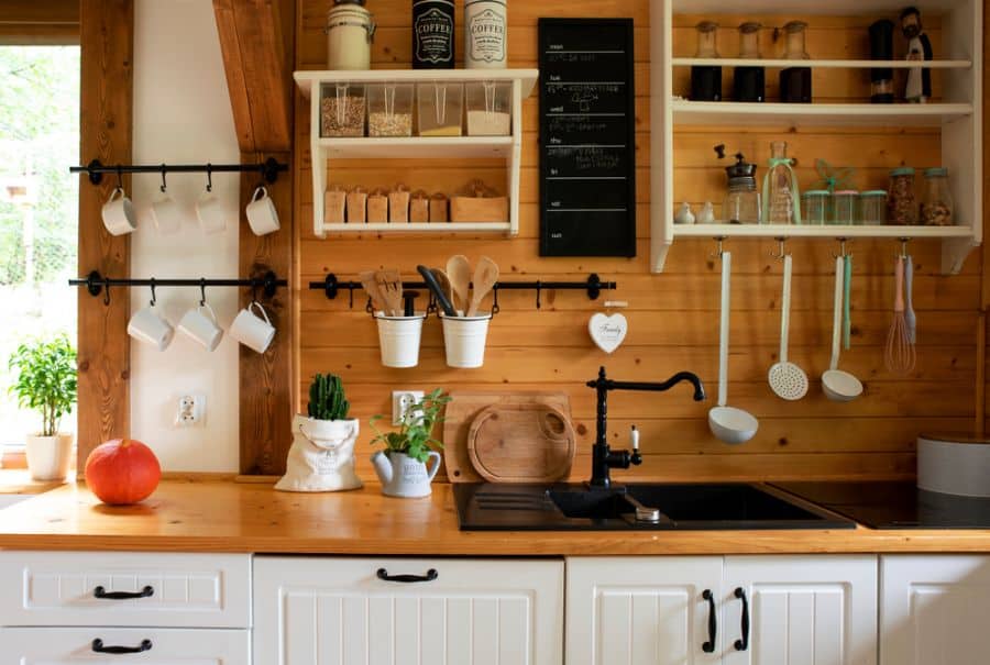 rustic cabin chalkboard wall shelves hanging mugs and utensils 