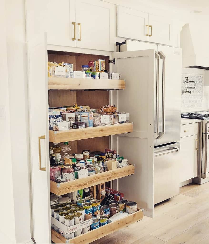 large built-in kitchen closet with white doors 