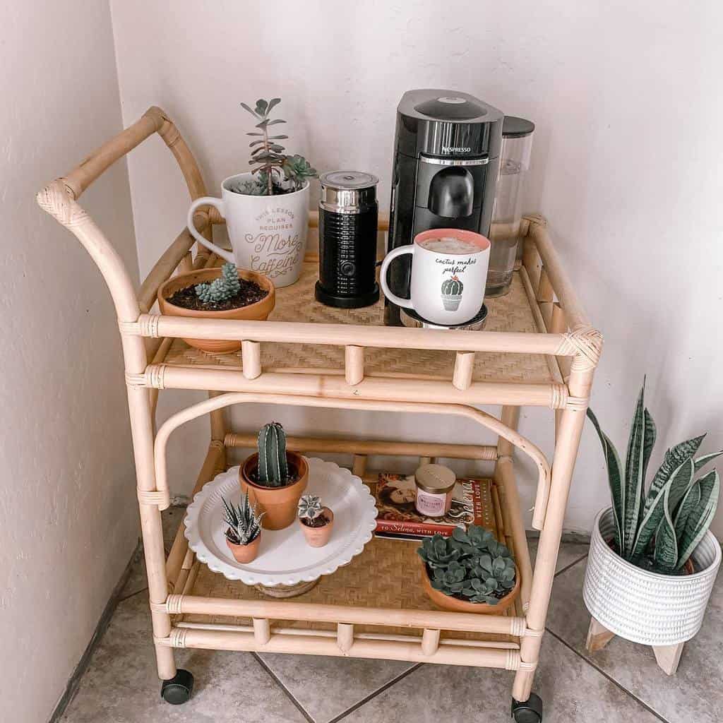 Boho-style wicker coffee cart with succulents, cactus decor, and a coffee machine.