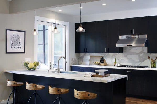 Contemporary black kitchen with marble countertops, pendant lights, and wooden bar stools.