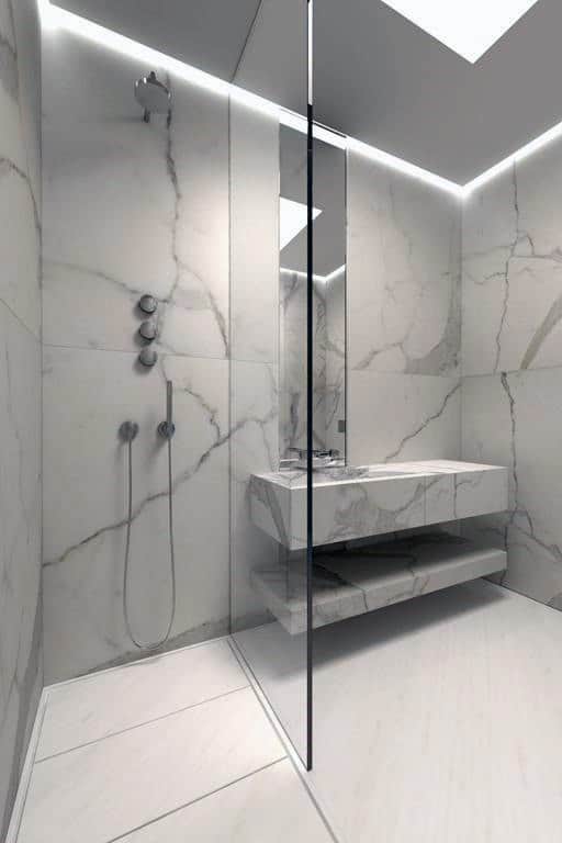 Minimalist bathroom with floor-to-ceiling marble tiles, glass shower, and floating vanity.