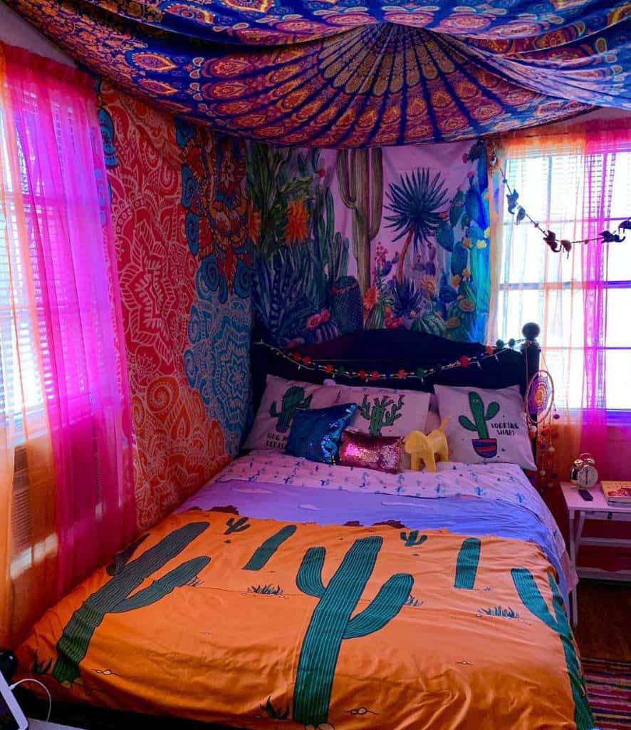 Bohemian bedroom with cactus bedding, colorful tapestry ceiling, and vibrant curtains.