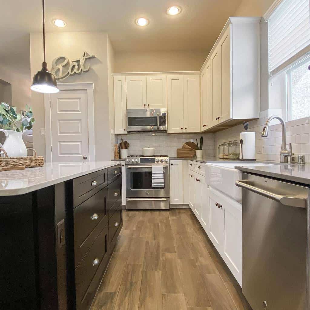 rustic corner kitchen white and black cabinets apron sink metal appliances 