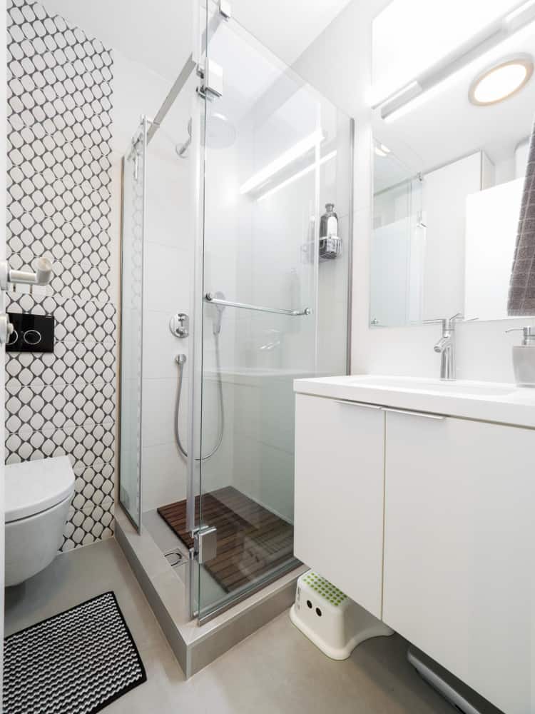 corner shower in white bathroom 