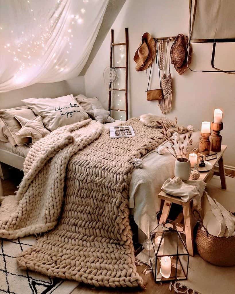 Cozy boho bedroom with warm lights, knit blankets, and natural accents.