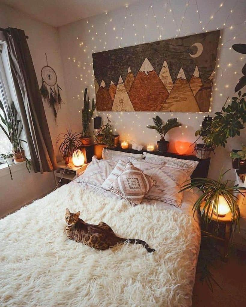 Cozy boho bedroom with fairy lights, plants, and a fluffy bedspread.