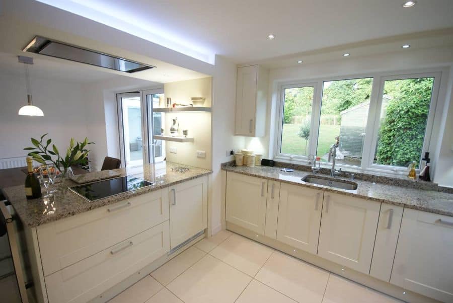 cream kitchen with granite countertops 