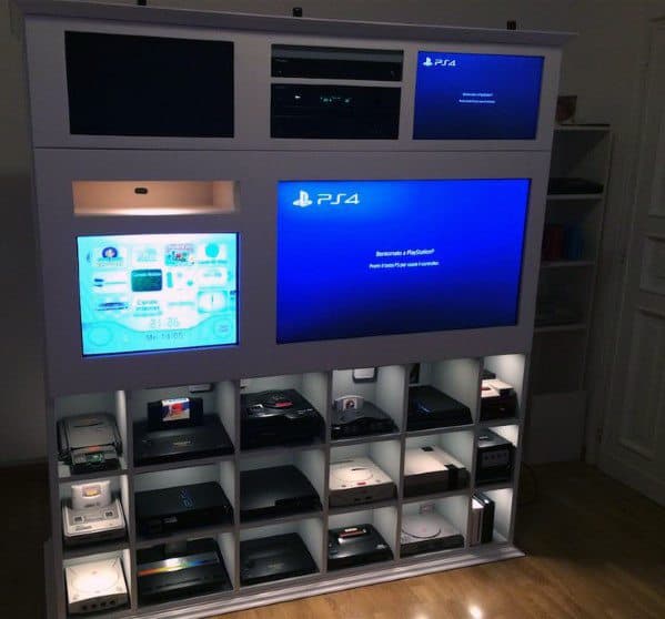 A large entertainment setup with multiple gaming consoles and screens displaying various interfaces