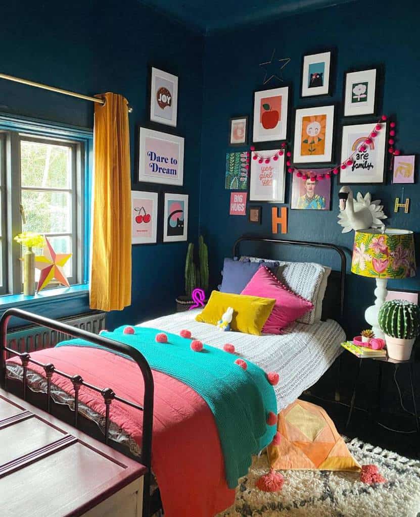 Vibrant kids' bedroom with colorful framed wall art, yellow curtains, and cozy bedding accents.