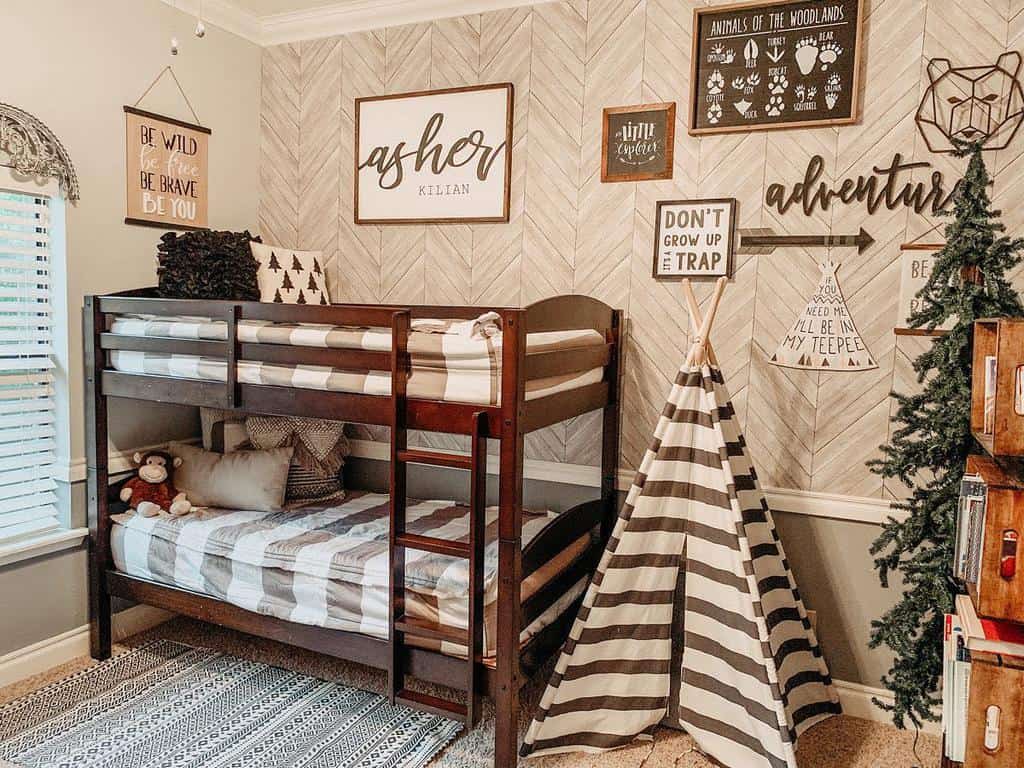 Rustic kids' bedroom with bunk bed, striped tepee, framed wall art, and wooden accents.