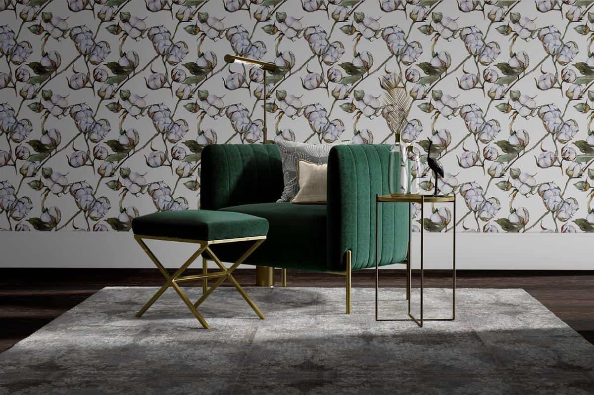 floral wallpaper with green accent chair 