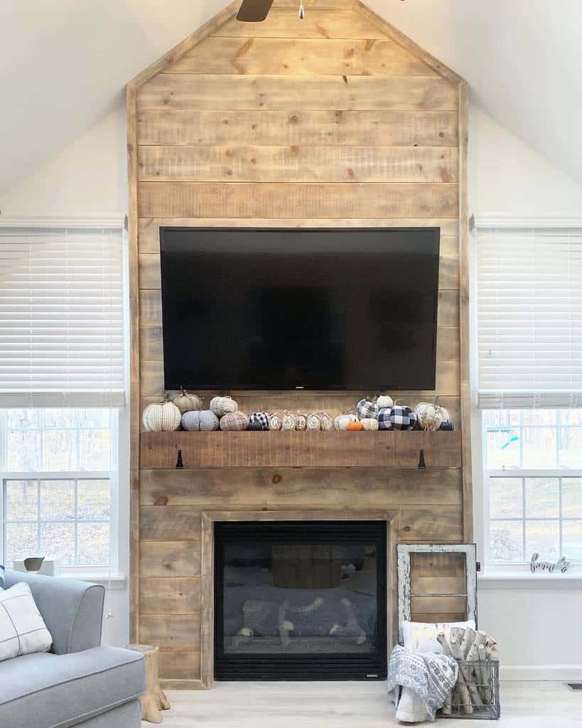 wood shiplap wall electric fireplace wall mounted tv gray sofa