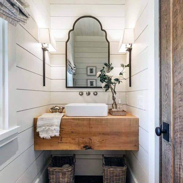 small rustic wood countertop in white shiplap bathroom 