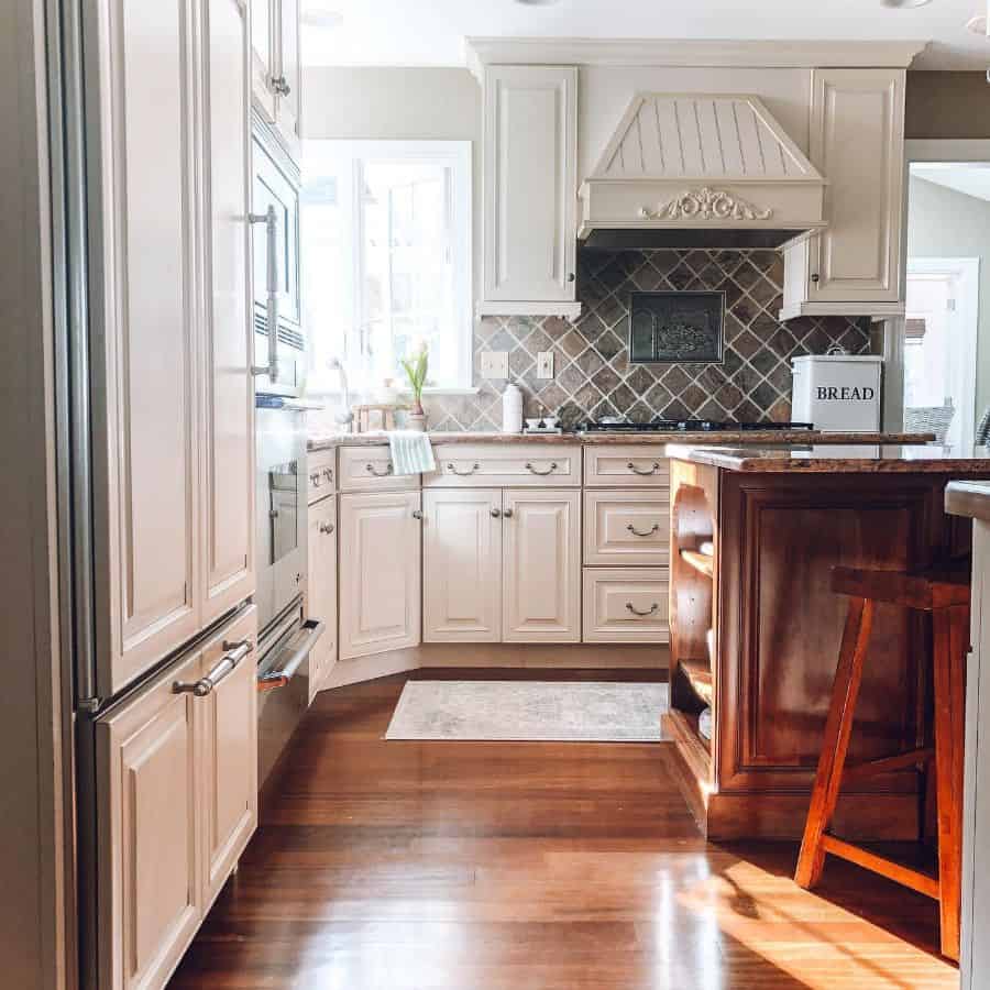 vintage style farmhouse kitchen with ornate range hood