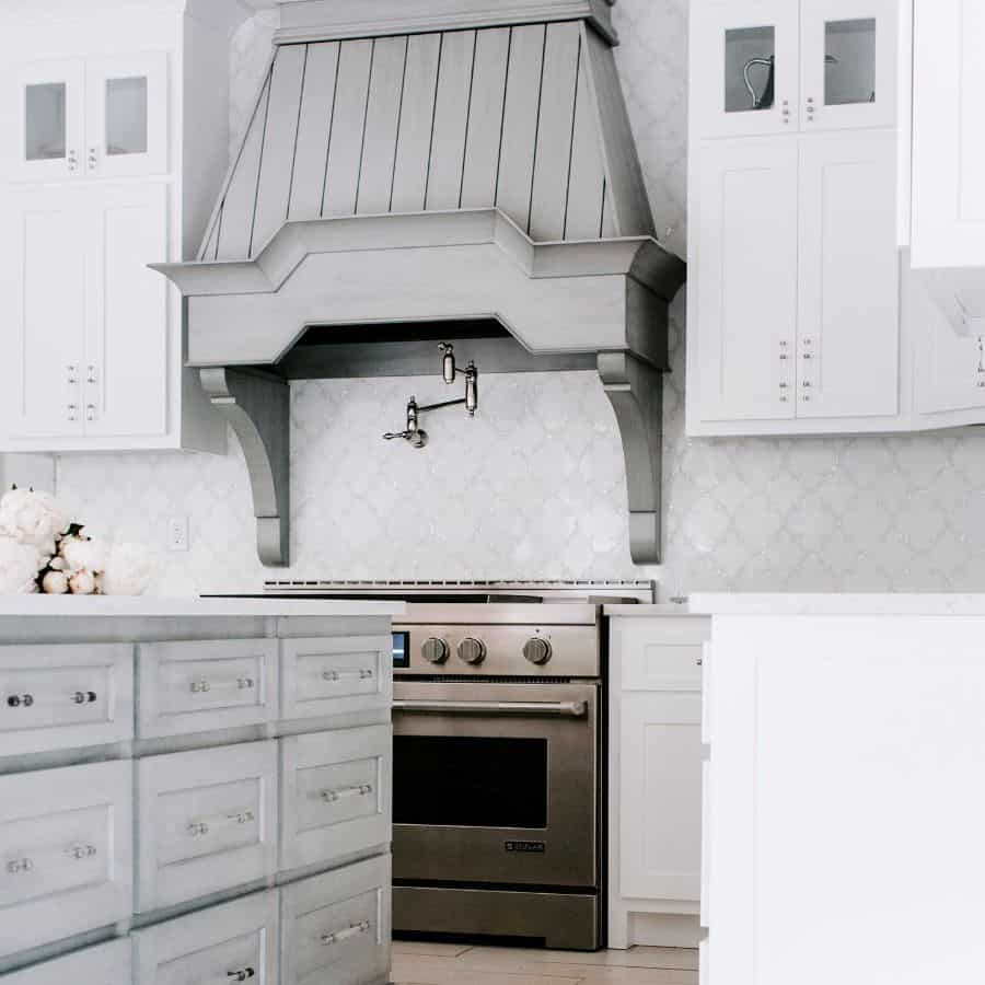 vintage gray range hood in white kitchen 