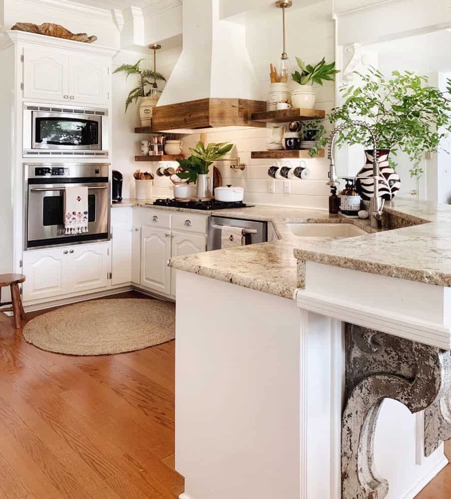 boho rustic kitchen with white cabinets and gray granite countertops