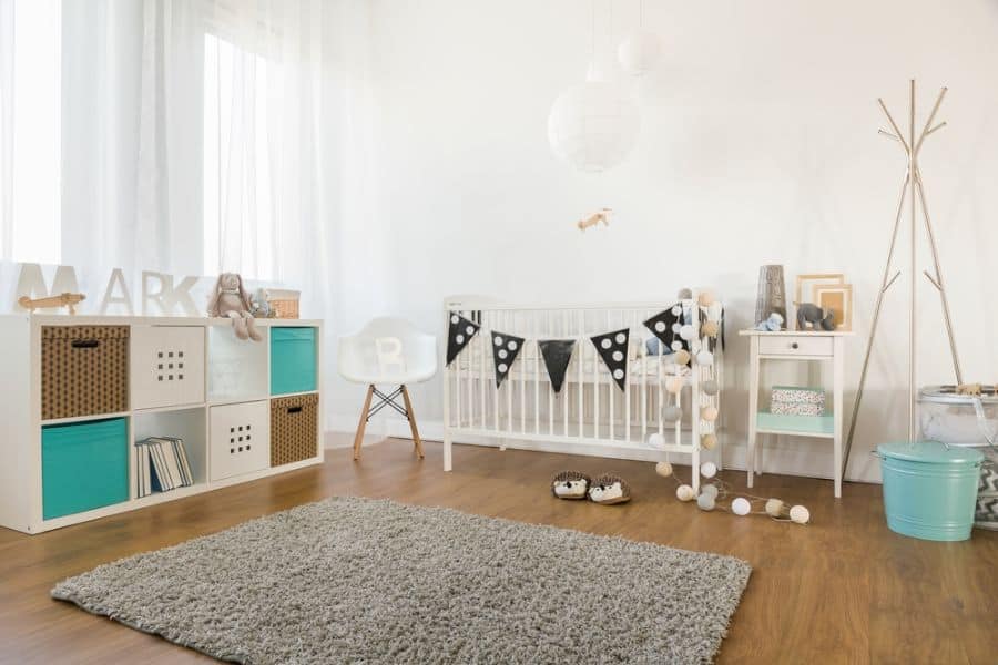 Gender-neutral baby room with simple decor and soft color accents.