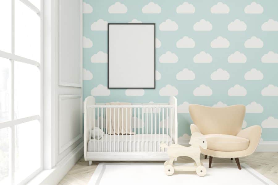 aby room with clouds wallpaper and a soft, neutral design.