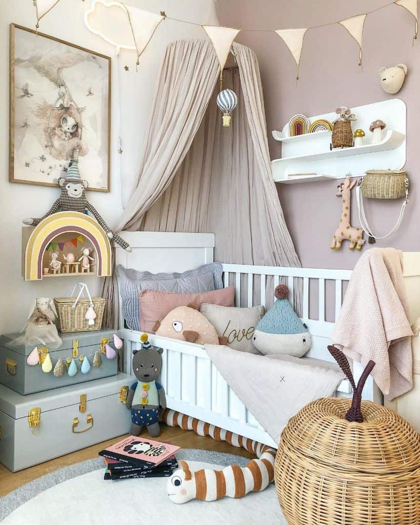 Whimsical baby girl's room with animal toys, soft pastel decor, and cozy canopy over crib.