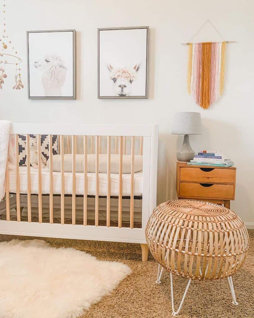 Modern baby room with llama wall art, wooden crib, and cozy woven decor accents.