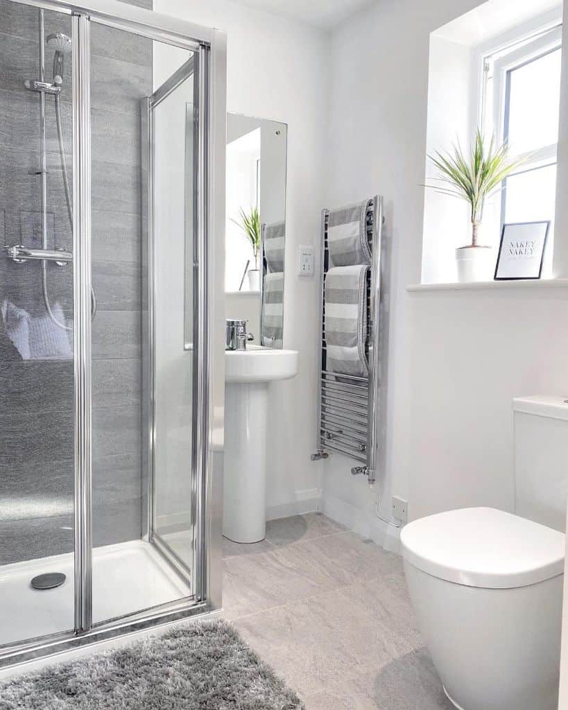 glass shower in white modern bathroom 