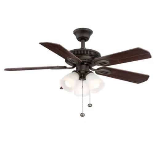 Bronze ceiling fan with dark wooden blades and three frosted glass light fixtures.