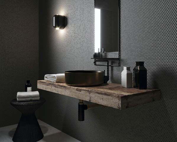 Luxurious bathroom with textured dark walls, rustic wooden vanity, and round vessel sink.