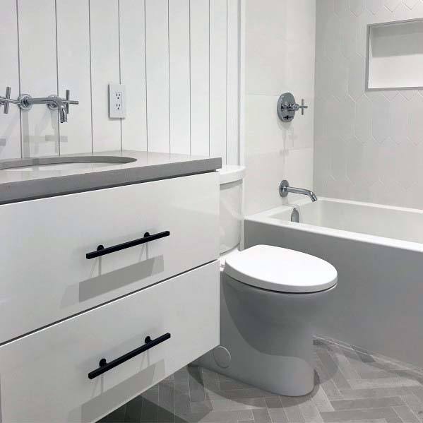 vertical shiplap wall in modern white bathroom 