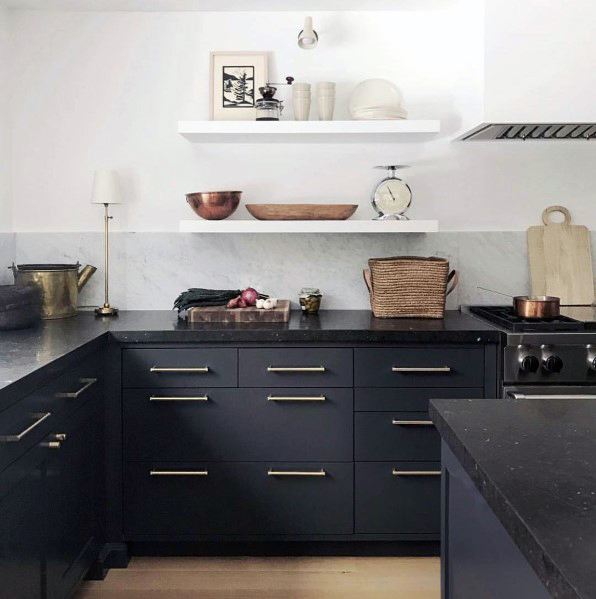 modern kitchen with black cabinets and white shelves 