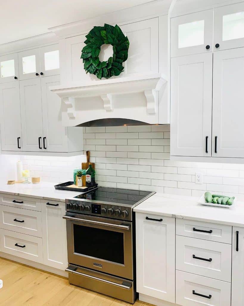 country kitchen subway tile splashback white cabinets black accents 